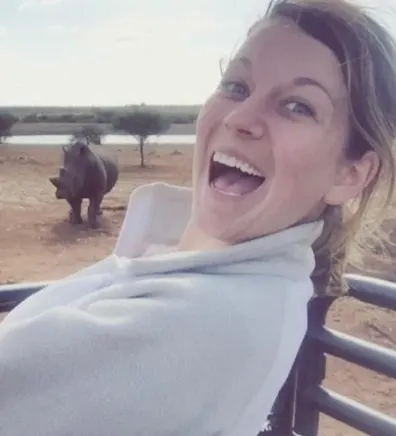 Erin with rhinoceros in the background